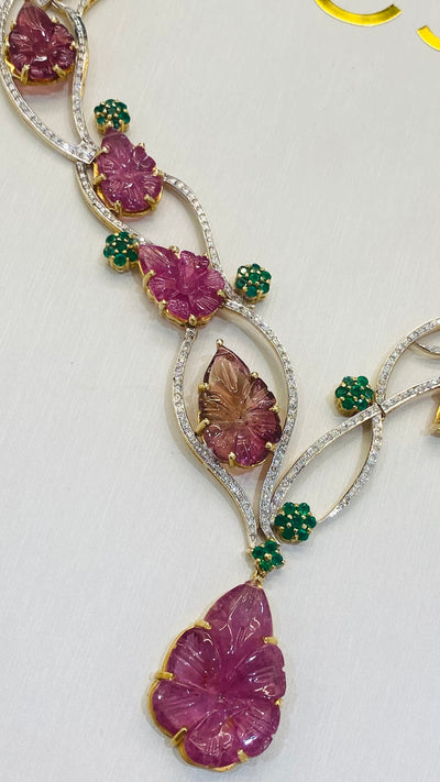 Tourmaline Carved Leaves, Emerald & Diamond Necklace In 18K Yellow Gold - Tresor Collection Close-up of ruby and emerald statement necklace – intricate leaf-inspired fine jewelry design