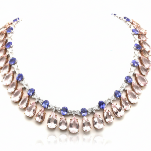 Necklace with teardrop-shaped crystals on a white background