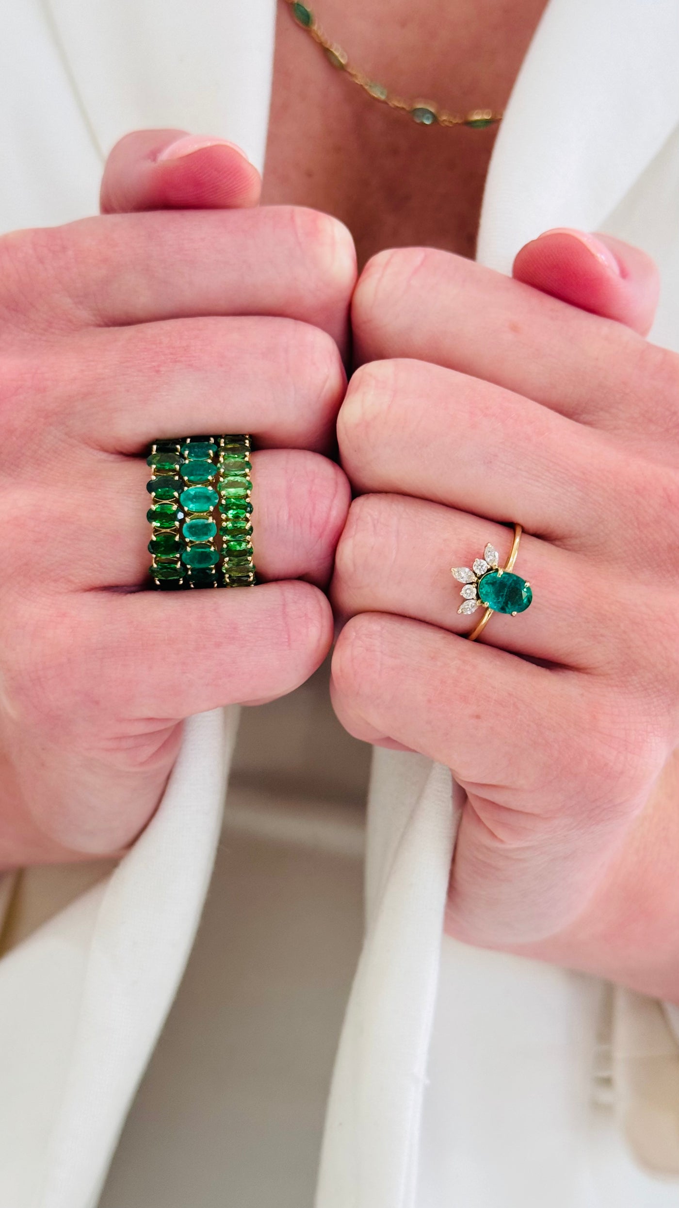 Emerald Oval Ring In 18K Yellow Gold - Tresor Collection Close-up of woman styling green emerald ring stack – sophisticated fine jewelry by Tresor Collection