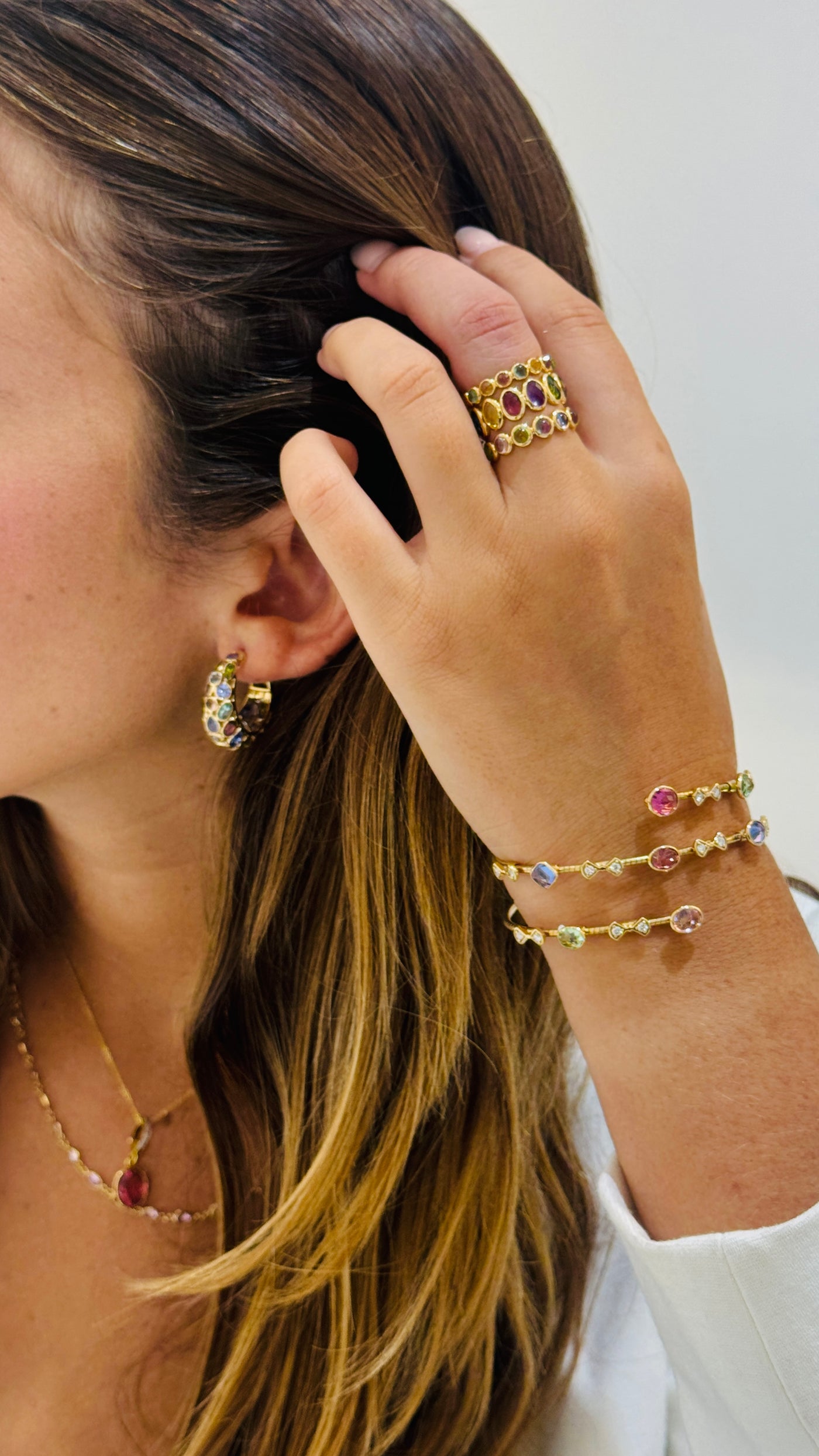 18K gold multi-gemstone bangle styled with casual elegance – designer jewelry for women by Tresor Collection