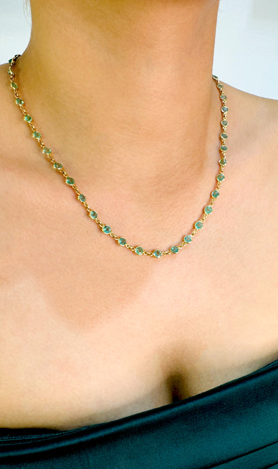 Emerald Round Necklace In 18K Yellow Gold - Tresor Collection Side view of 18K gold emerald beaded necklace on model – luxury gemstone jewelry by Tresor Collection
