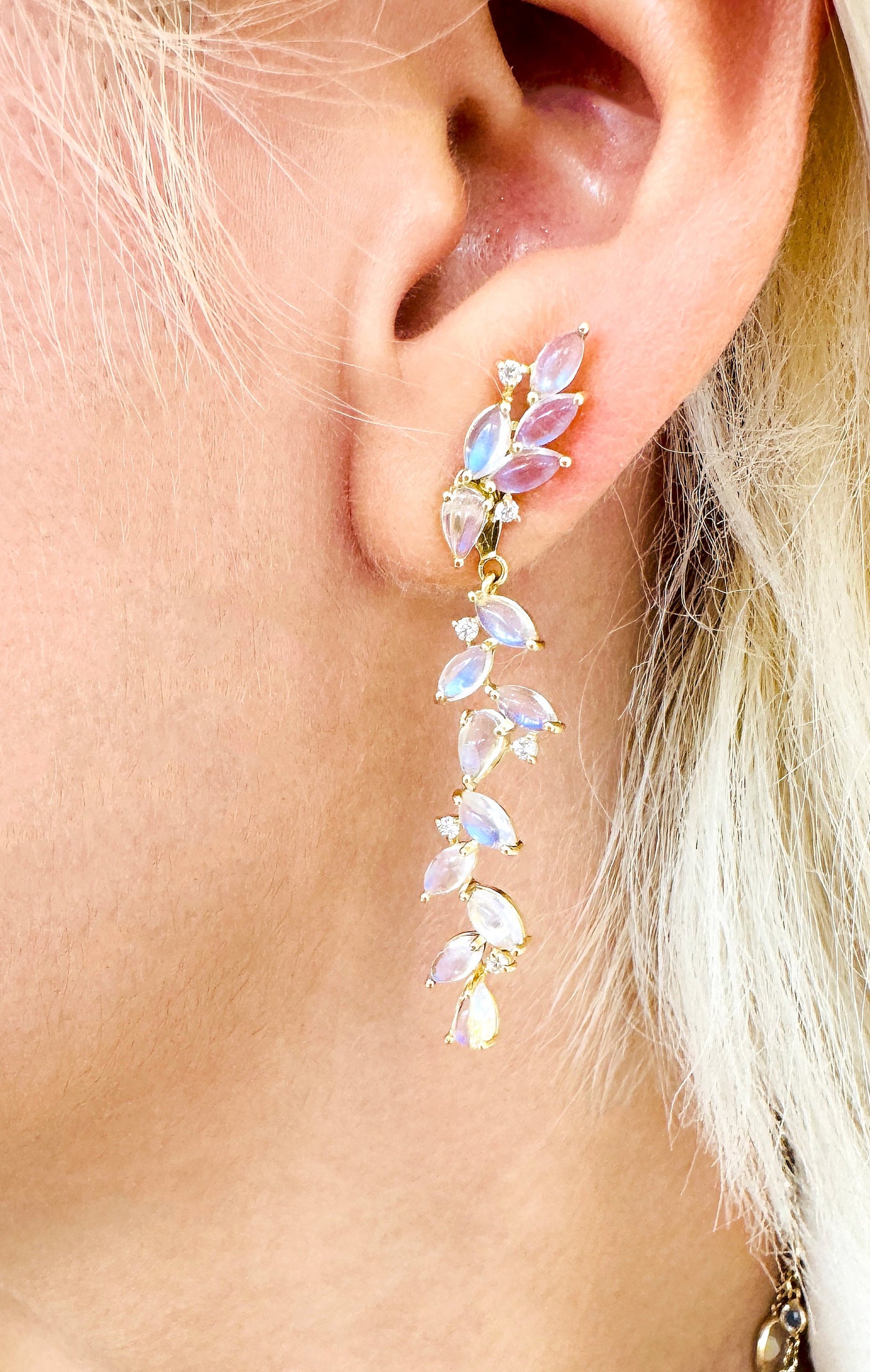 18K gold Rainbow Moonstone earrings close-up – showcasing intricate craftsmanship with marquise-cut stones.