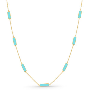 Necklace with turquoise rectangular stones on a gold chain against a white background 18K gold turquoise necklace flatlay – luxury fine jewelry by Tresor Collection