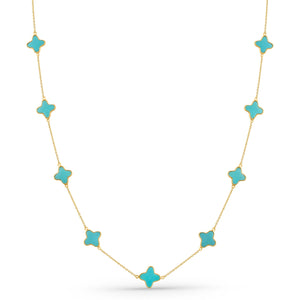 Necklace with turquoise star-shaped pendants on a white background 18K gold turquoise star necklace flatlay – luxury fine jewelry by Tresor Collection