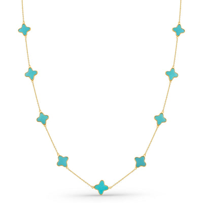 Necklace with turquoise star-shaped pendants on a white background 18K gold turquoise star necklace flatlay – luxury fine jewelry by Tresor Collection