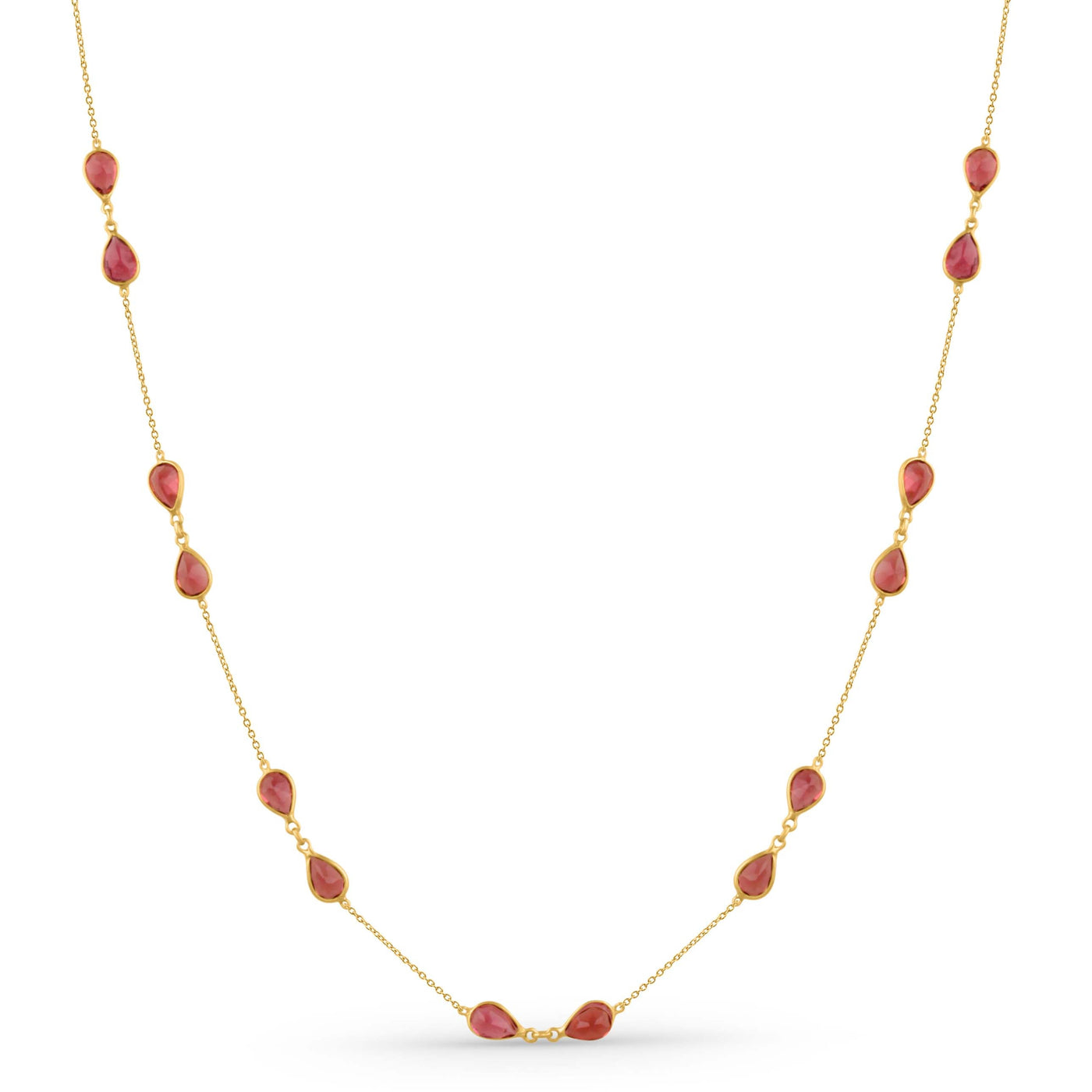 Gold necklace with red beads on a white background 18K gold pink tourmaline necklace flatlay – luxury fine jewelry by Tresor Collection