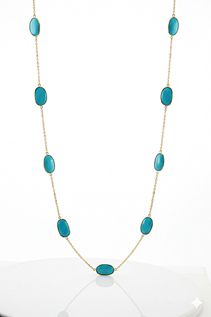 Turquoise stone necklace on a white background