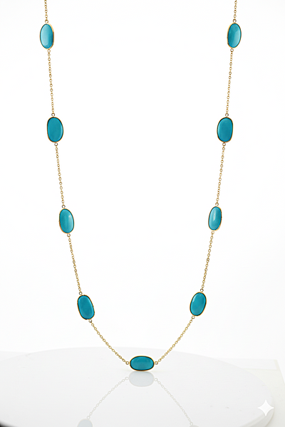 Turquoise stone necklace on a white background