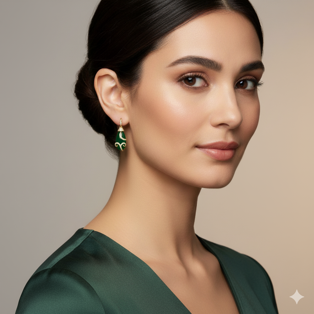 Emerald gold earrings styled for parties and bridal looks – luxury handcrafted jewelry by Tresor Collection Woman wearing green earrings with a neutral background