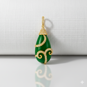 Green teardrop pendant with gold accents on a light gray background
