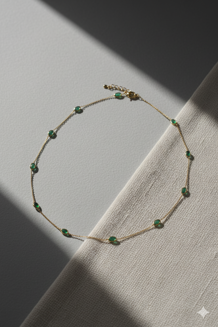 Delicate necklace with green beads on a textured surface