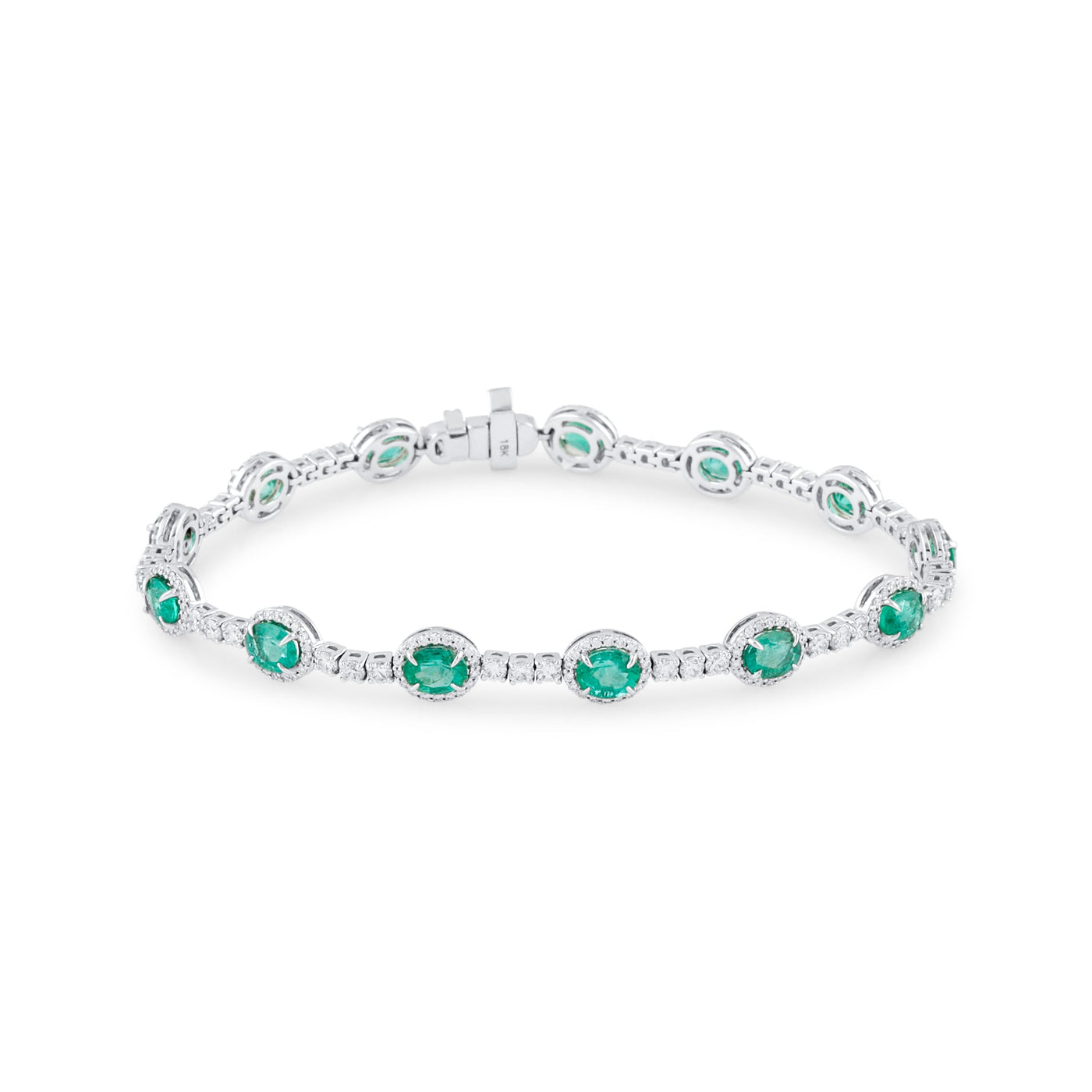 18K White Gold Emerald & Diamond Oval Bracelet by Tresor Collection White gold emerald bracelet flatlay – elegant green gemstone jewelry by Tresor Collection