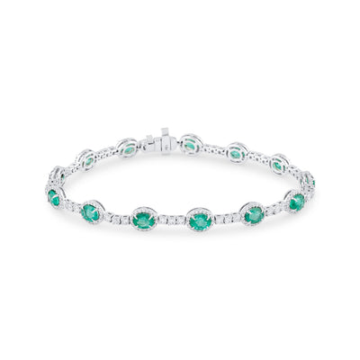 18K White Gold Emerald & Diamond Oval Bracelet by Tresor Collection White gold emerald bracelet flatlay – elegant green gemstone jewelry by Tresor Collection