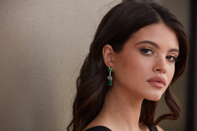 Emerald P/S & Diamond Earring In 18K White Gold - Tresor Collection Model wearing emerald and diamond floral drop earrings – elegant fine jewelry styling
