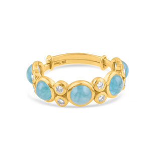 Gold bracelet with blue stones and diamonds on a white background 18K gold aquamarine and diamond ring flatlay – luxury fine jewelry by Tresor Collection