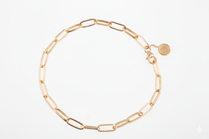 Gold chain bracelet on a white background