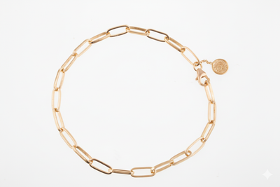 Gold chain bracelet on a white background