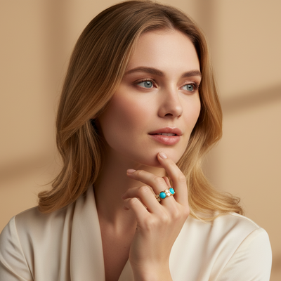 Woman wearing a ring with a beige background