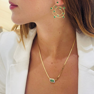 Elegant emerald gold necklace on model – designer fine jewelry for women by Tresor Collection