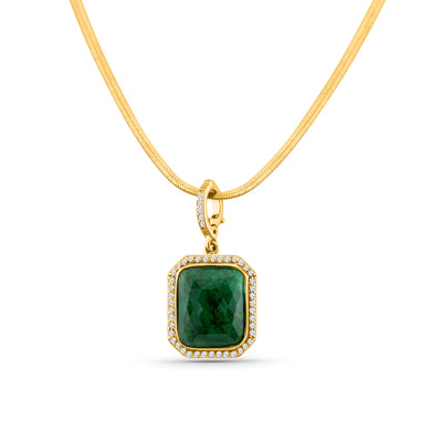Close-up of 18K gold emerald and diamond pendant – statement fine jewelry from Tresor Collection boutique