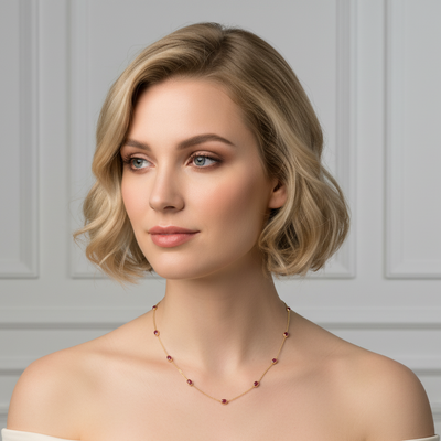 Woman wearing a delicate necklace against a neutral background Elegant ruby gold necklace on model – designer fine jewelry for women by Tresor Collection