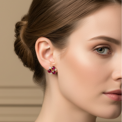 Woman wearing red earrings against a beige wall Elegant ruby and diamond floral earrings on model – designer gold jewelry for women by Tresor Collection